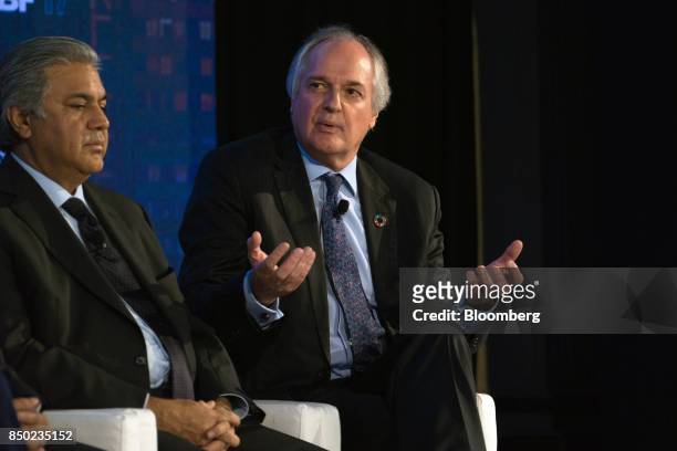 Paul Polman, chief executive officer of Unilever NV, right, speaks while Arif Naqvi, chief executive officer of Abraaj Capital Ltd., listens during...