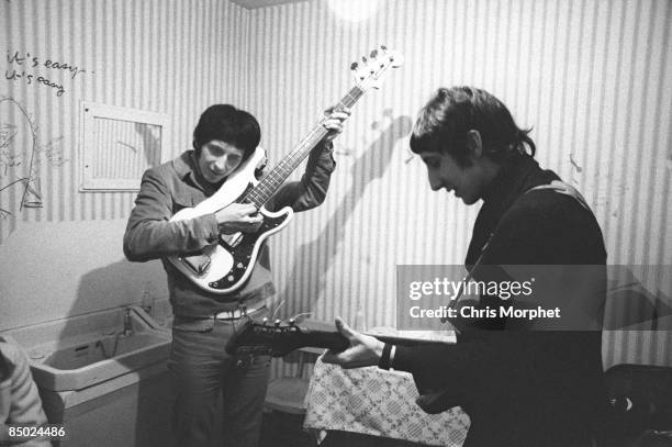 Photo of Pete TOWNSHEND and John ENTWISTLE and The Who, John Entwistle & Pete Townshend, rehearsing backstage - gig performed without Roger