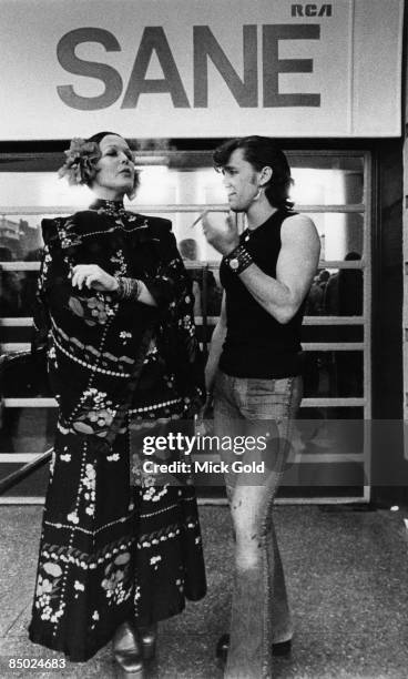 Two fans pose outside the Earls Court concert venue during David Bowie's 'Aladdin Sane' Tour in London on 12th May 1973.