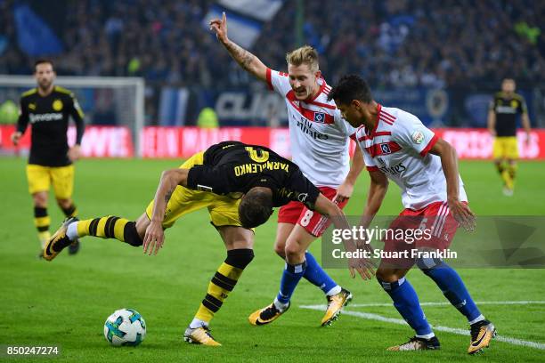 Andrej Yaromolenko of Dortmund , Lewis Holtby of Hamburg and Douglas Santos of Hamburg during the Bundesliga match between Hamburger SV and Borussia...