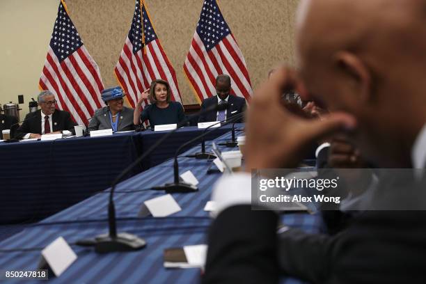 House Minority Leader Rep. Nancy Pelosi speaks as Rep. Alma Adams and Rep. Bobby Scott listen during a roundtable discussion September 20, 2017 on...