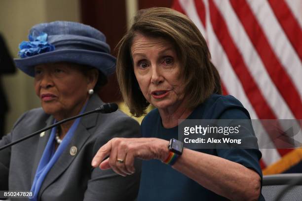 House Minority Leader Rep. Nancy Pelosi speaks as Rep. Alma Adams listens during a roundtable discussion September 20, 2017 on Capitol Hill in...