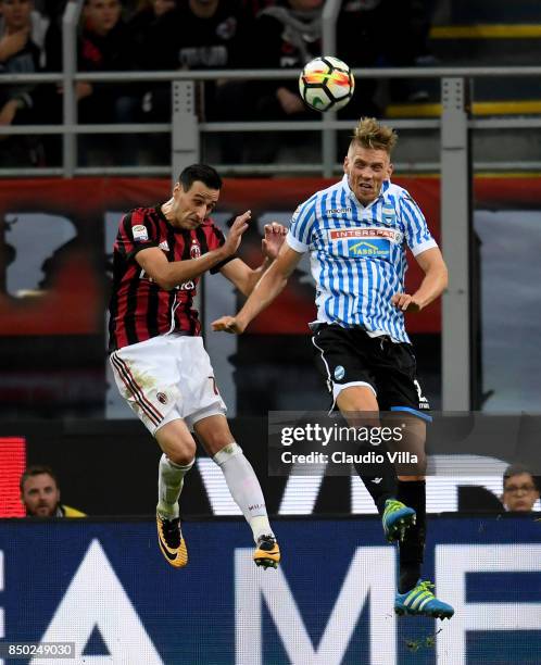 Nikola Kalinic of AC Milan and Bartosz Salamon of Spal compete for the ball during the Serie A match between AC Milan and Spal at Stadio Giuseppe...