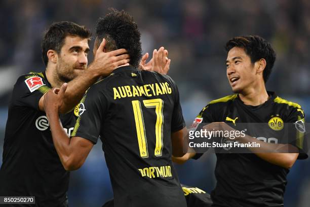 Pierre-Emerick Aubameyang of Dortmund celebrates with Sokratis Papastathopoulos of Dortmund and Shinji Kagawa of Dortmund after he scores his teams...