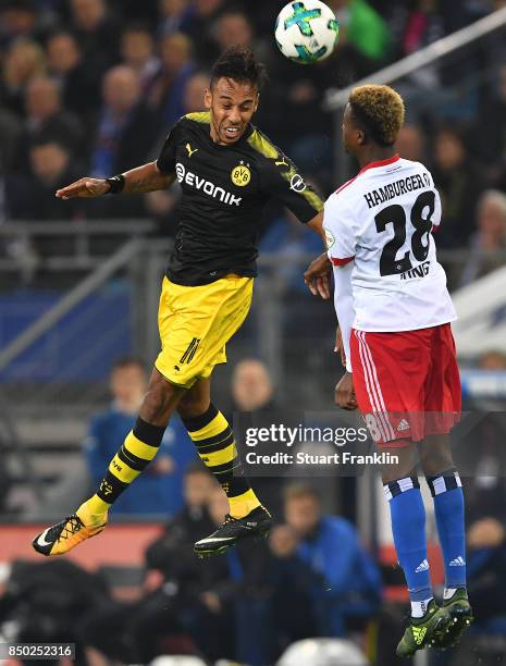 Pierre-Emerick Aubameyang of Dortmund fights for the ball with Gideon Jung of Hamburg during the Bundesliga match between Hamburger SV and Borussia...