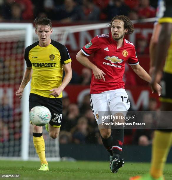 Daley Blind of Manchester United in action with Joe Mason of Burton Albion during the Carabao Cup Third Round between Manchester United and Burton...