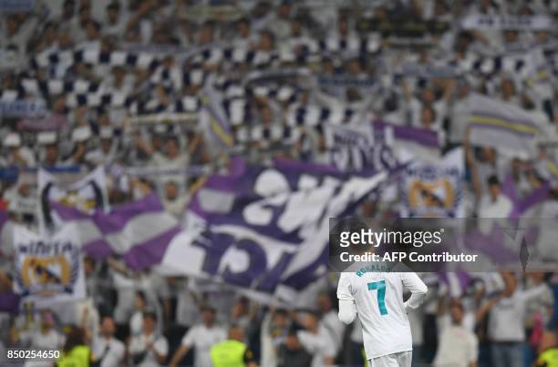 Real Madrid's forward from Portugal Cristiano Ronaldo runs during the Spanish league football match Real Madrid CF against Real Betis at the Santiago...