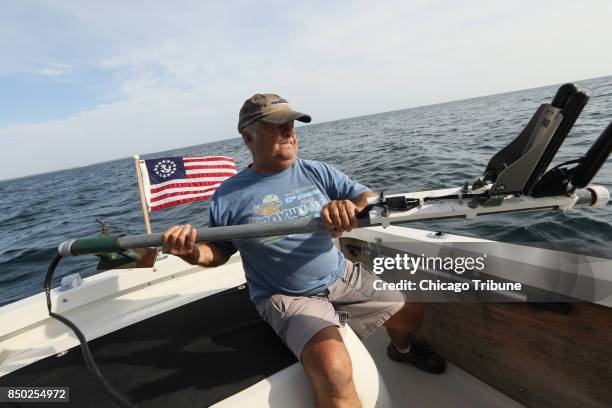 Shipwreck enthusiast Steve Radovan, of Sheboygan, Wis., stows a sonar transducer on his boat Wednesday, Aug. 9, 2017 in Lake Michigan. An avid...