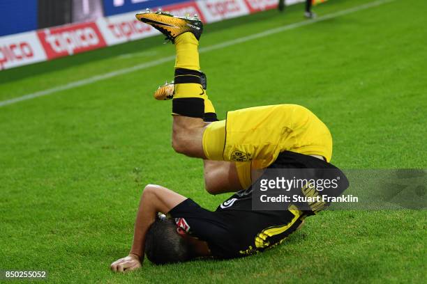 Christian Pulisic of Dortmund celebrates after he scored his teams third goal to make it 3:0 during the Bundesliga match between Hamburger SV and...