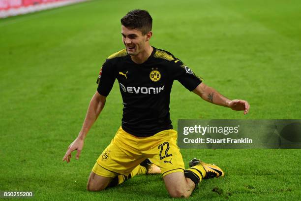 Christian Pulisic of Dortmund celebrates after he scored his teams third goal to make it 3:0 during the Bundesliga match between Hamburger SV and...