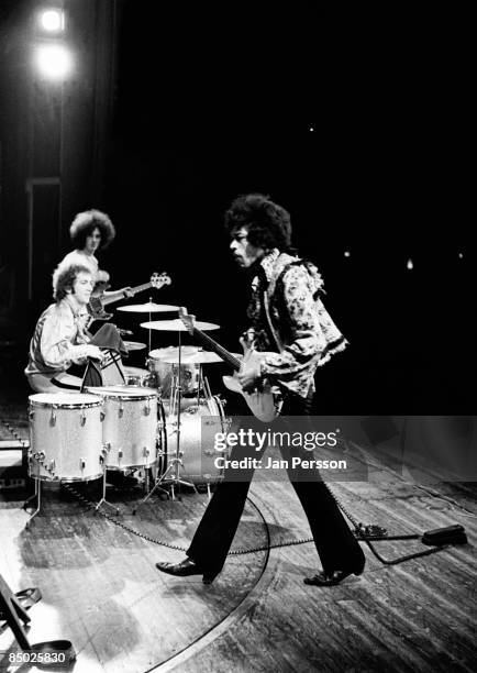 Photo of Jimi Hendrix 1; Jimi Hendrix in the background drummer Mitch Mitchell and basplayer Noel Redding Tivolis Koncertsal January 7 1968