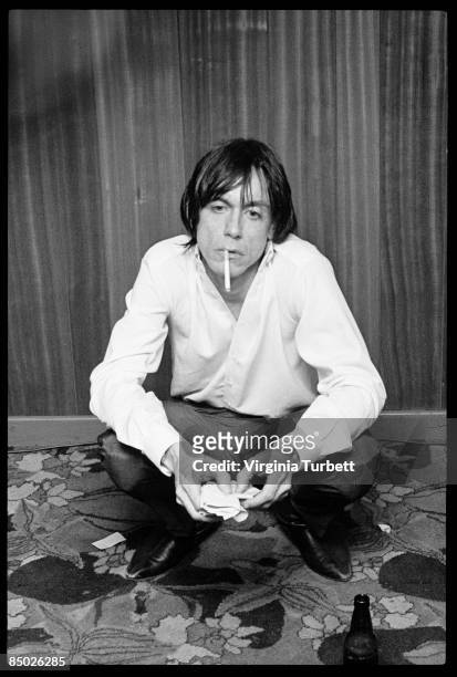 Iggy Pop smoking a cigarette backstage at The Apollo Theatre, Manchester 7th February 1980.