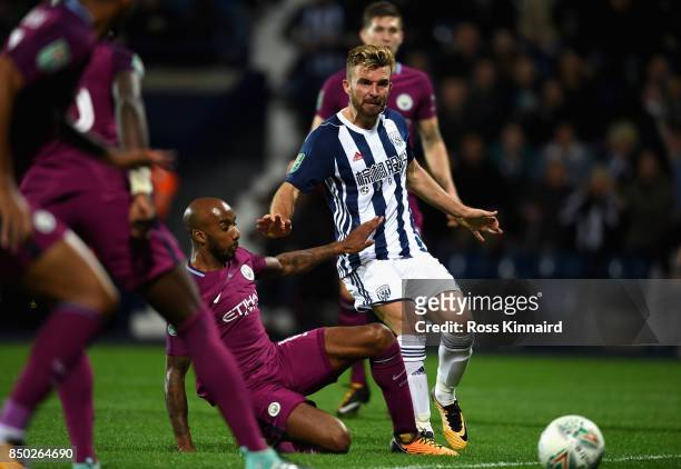 Fabian Delph of Manchester City tackles James Morrison of West Bromwich Albion during the Carabao Cup Third Round match between West Bromwich Albion...
