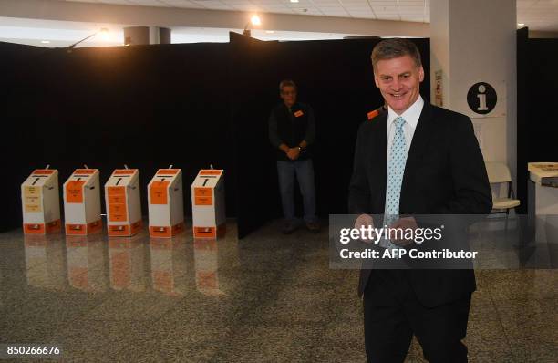 Prime Minister of New Zealand Bill English arrives to cast his vote for the 2017 general election in Wellington on September 21, 2017. English has...