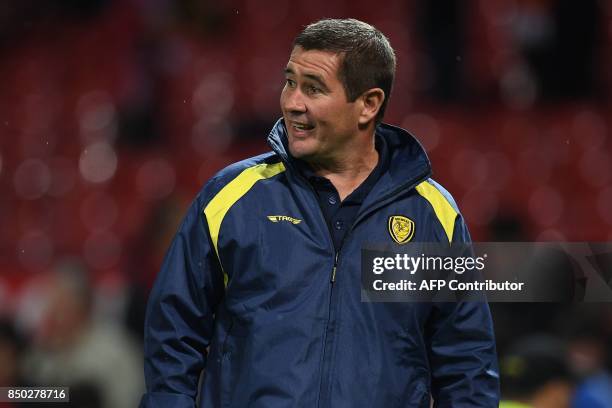 Burton Albion's English manager Nigel Clough leaves following the English League Cup third round football match between Manchester United and Burton...