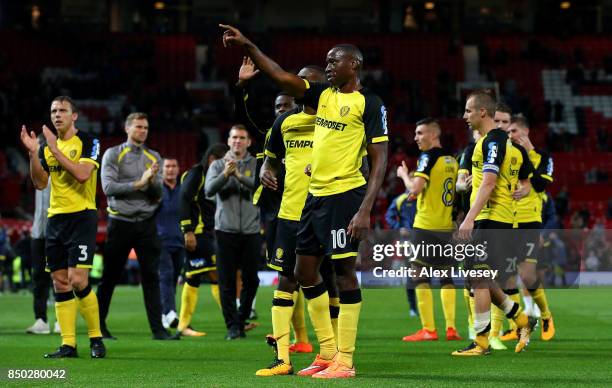 Lucas Akins of Burton Albion and team mates show appreciation to their fans during the Carabao Cup Third Round match between Manchester United and...