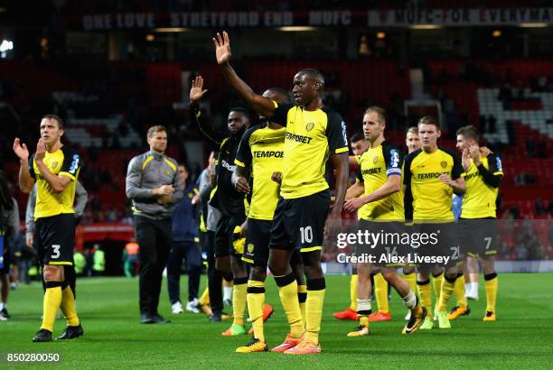 Lucas Akins of Burton Albion and team mates show appreciation to their fans during the Carabao Cup Third Round match between Manchester United and...