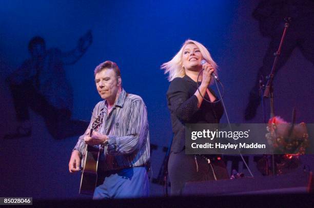 Photo of Marty WILDE and Kim WILDE, with Marty Wilde performing live onstage on Marty Wilde's 50th Anniversary Tour