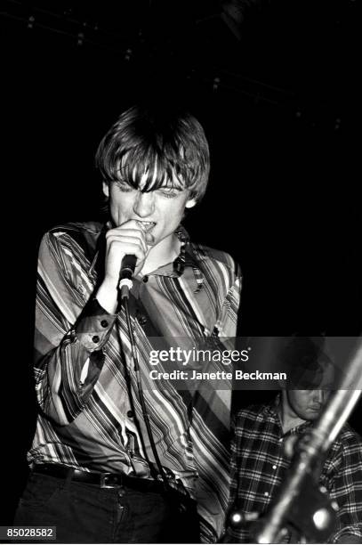 Mark E. Smith performing with The Fall, London, 1978. On the right is bassist Steve Hanley.