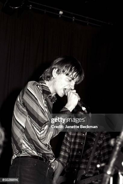 Mark E. Smith performing with The Fall, London, 1978. On the right is bassist Steve Hanley.