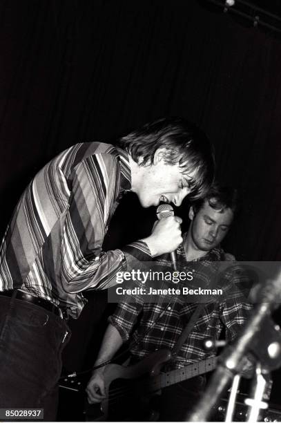 Mark E. Smith performing with The Fall, London, 1978. On the right is bassist Steve Hanley.