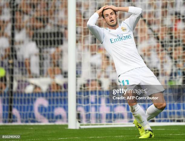 Real Madrid's forward from Wales Gareth Bale gestures after missing an opportunity on goal during the Spanish league football match Real Madrid CF...