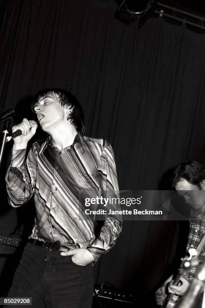 Mark E. Smith performing with The Fall, London, 1978. On the right is bassist Steve Hanley.