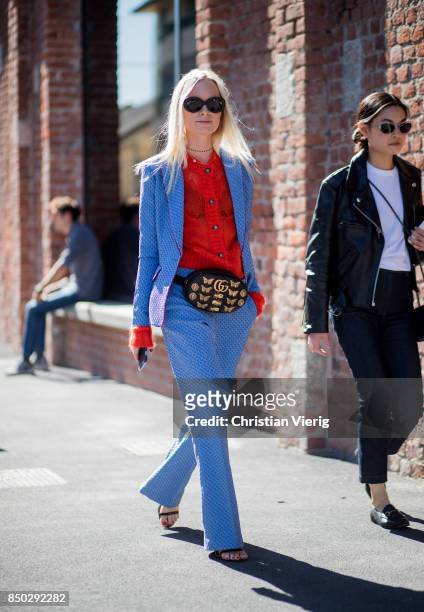 Thora Valdimars wearing Gucci belt bag, red cardigan, blue suit is... News  Photo - Getty Images
