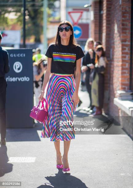 Giovanna Engelbert wearing a tshirt with the print "my favorite colour is rainbow flag", midi skirt is seen outside Gucci during Milan Fashion Week...
