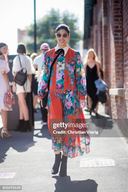 Caroline Issa wearing an orange dress with floral print is seen outside Gucci during Milan Fashion Week Spring/Summer 2018 on September 20, 2017 in...