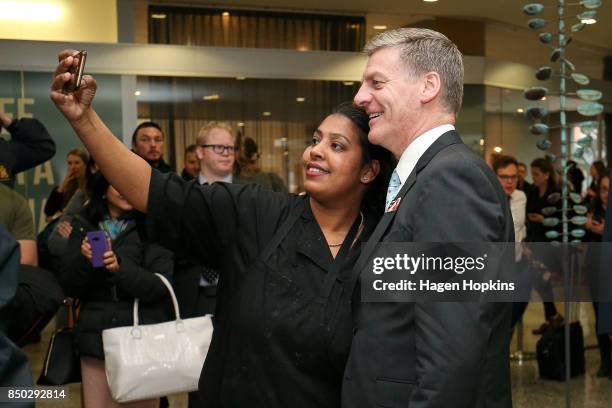 Prime Minister Bill English talks to a member of the public after casting his vote for the 2017 General Election at Asteron Tower on September 21,...