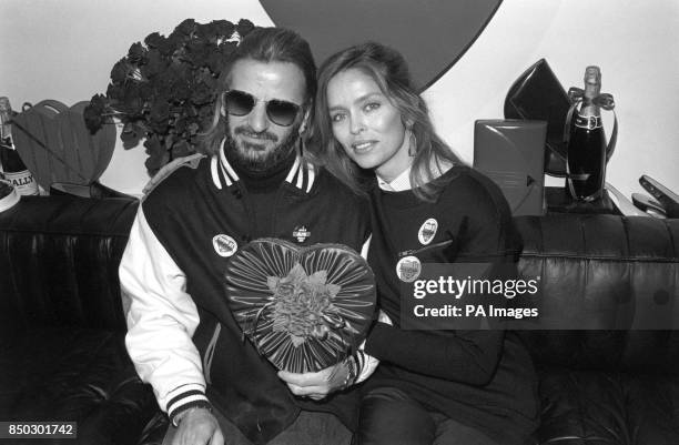 Former Beatles drummer Ringo Starr and his actress wife Barbara Bach share a Valentine's Day heart in a Bond Street shop in London, where the couple...