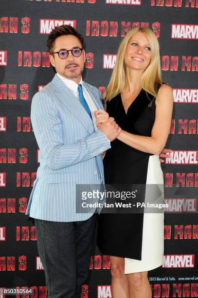 Robert Downey Jr and Gwyneth Palttrow at a photocall for new film Iron Man 3 at the Dorchester Hotel in London.