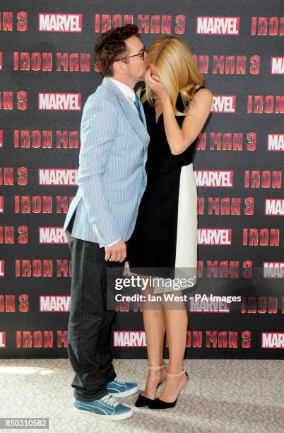 Robert Downey Jr and Gwyneth Paltrow at a photocall for new film Iron Man 3 at the Dorchester Hotel in London.