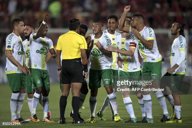 Brazil's Chapecoense players complain about the first Flamengo goal with Peruvian referee Michael Espinoza during their 2017 Copa Sudamericana...