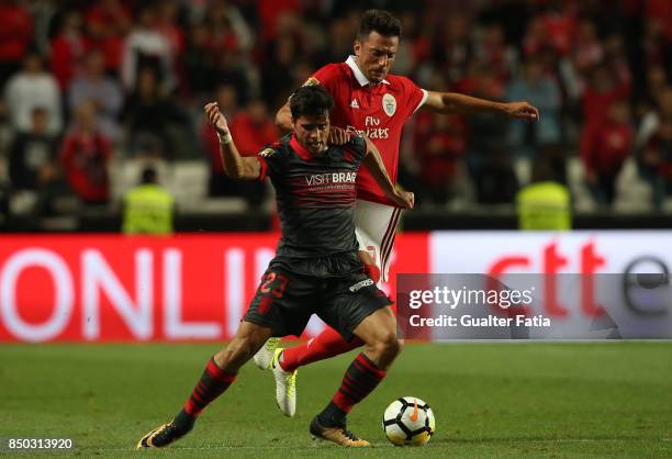 Braga forward Joao Carlos Teixeira from Portugal with SL Benfica midfielder Andreas Samaris from Greece in action during the Portuguese League Cup...