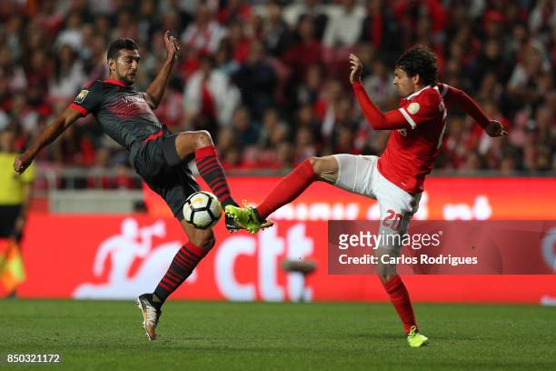 Braga forward Ahmed Hassan from Egypt vies with Benfica's midfielder Filip Krovinovic from Croatia for the ball possession during the match between...