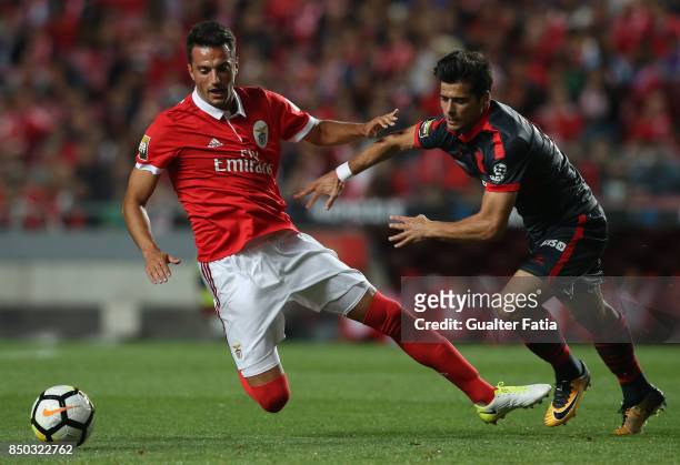 Benfica midfielder Andreas Samaris from Greece tackled by Joao Carlos Teixeira during the Portuguese League Cup match between SL Benfica and SC Braga...