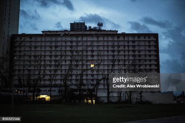 Building is dark during a total blackout after Hurricane Maria made landfall September 20, 2017 in San Juan, Puerto Rico. Thousands of people have...