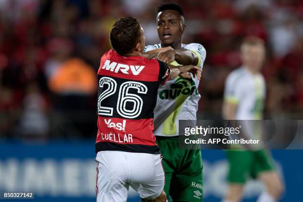 Moises Ribeiro of Brazil's Chapecoense fights with Cuellar of Brazil's Flamengo during their 2017 Copa Sudamericana football match held at Ilha do...
