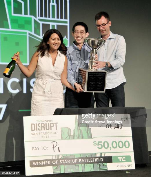 Pi Co-Founder and CTO Lixin Shi and Pi Co-Founder and CEO John MacDonald win the Startup Battlefield finals and are presented with a check during...