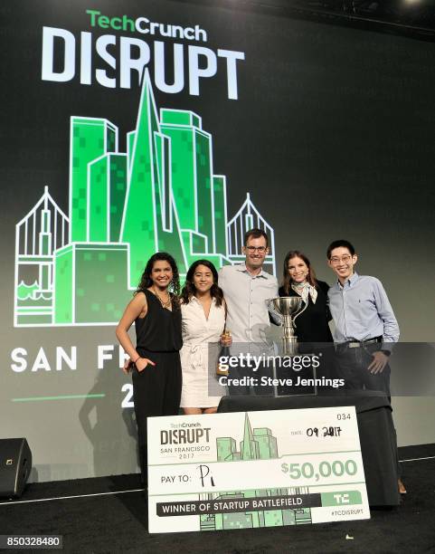 Pi Co-Founder and CTO Lixin Shi and Pi Co-Founder and CEO John MacDonald win the Startup Battlefield finals and are presented with a check during...