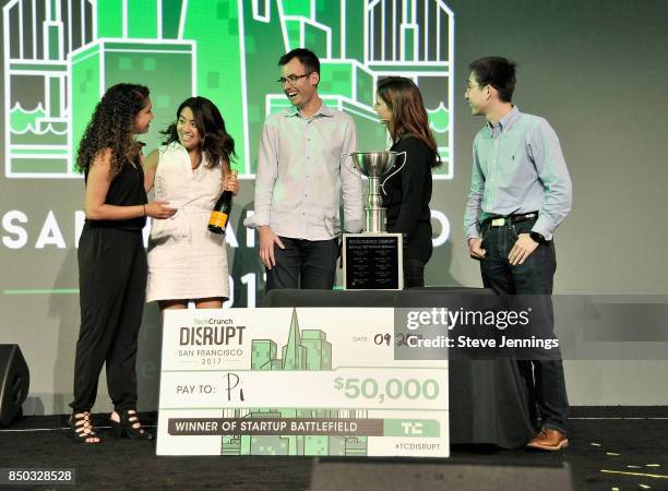 Pi Co-Founder and CTO Lixin Shi and Pi Co-Founder and CEO John MacDonald win the Startup Battlefield finals and are presented with a check during...