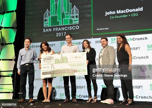 Pi Co-Founder and CTO Lixin Shi and Pi Co-Founder and CEO John MacDonald win the Startup Battlefield finals and are presented with a check from...