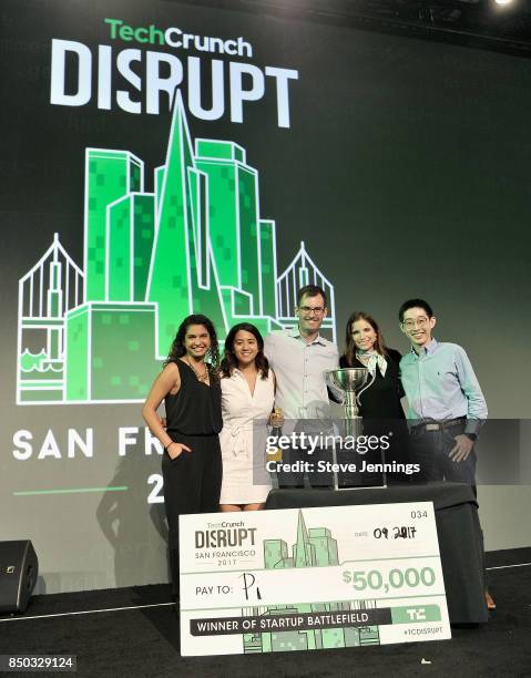 Pi Co-Founder and CTO Lixin Shi and Pi Co-Founder and CEO John MacDonald win the Startup Battlefield finals and are presented with a check during...