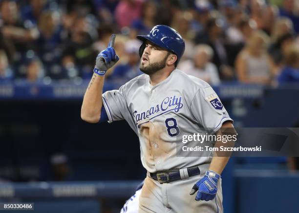 Mike Moustakas of the Kansas City Royals celebrates after hitting a solo home run in the sixth inning, setting a club record with 37 home runs in a...