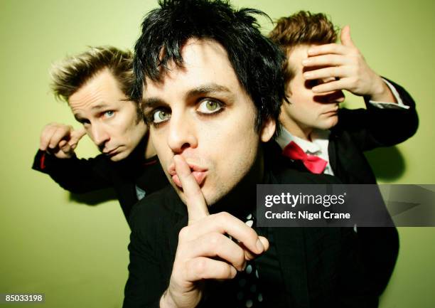 Photo of Billie Joe ARMSTRONG and GREEN DAY and Tre COOL and Mike DIRNT; L-R. Mike Dirnt, Billie Joe Armstrong, Tre Cool