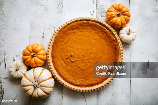 pumpkin pie on rustic background - fruit pie stock pictures, royalty-free photos & images