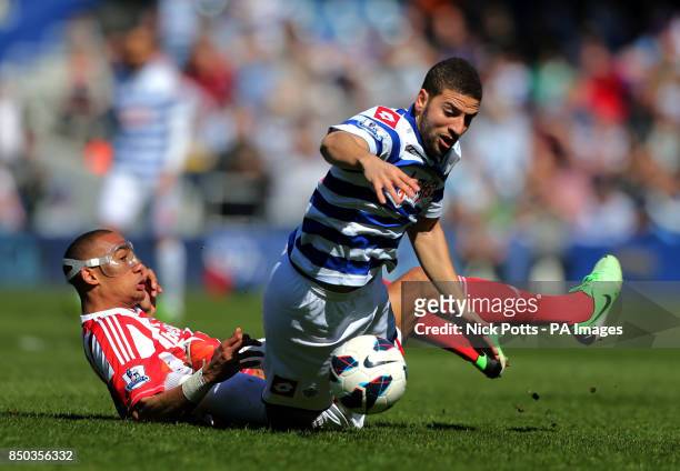 Queens Park Rangers' Adel Taaraby is fouled by Stoke City's Steven Nzonzi , during the Barclays Premier League match at Loftus Road, London.