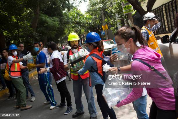 People help distribute supplies at Parque Mexico in the Condesa district the day after an earthquake on September 20, 2017 in Mexico City, Mexico....